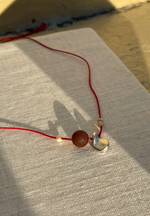 Pebble Charm on Red Silk Cord